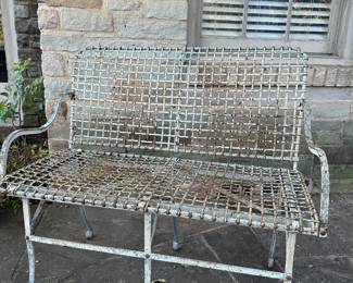 Old metal wire mesh garden bench 
