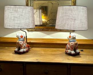 Matching pair of Chinese porcelain dog figurine lamps