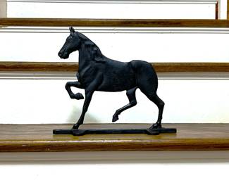 Old cast iron horse door stop with missing tail 