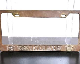 Vintage solid brass Cadillac License plate frame