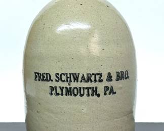 Antique 19th century salt glazed stoneware jug for Fred Schwartz & Bro of Plymouth, PA .....To register so you can place bids go to www.capitolsalesservices.hibid.com 