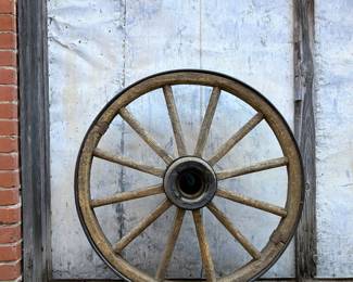 Authentic rustic wooden wagon wheel .....To register so you can place bids go to www.capitolsalesservices.hibid.com 