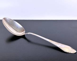 Large  silver (at least .826 purity)  .....To register so you can place bids go to www.capitolsalesservices.hibid.com serving spoon assayed by Christian F. Heise of Denmark  