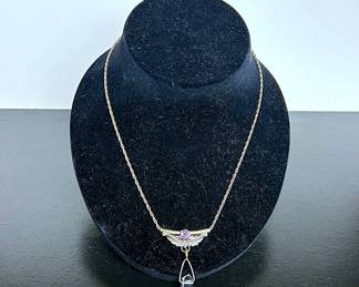 Sterling Pendant with Amethyst and a Quartz Crystal .....To register so you can place bids go to www.capitolsalesservices.hibid.com  