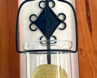 There are 4 wall mounted candle sconces 