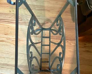 Glass top metal table with magazine storage