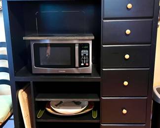 Kitchen Storage cabinet with space for small appliances and storage for oversized platters and cutting boards 