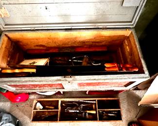 Interior of antique tool chest with tools