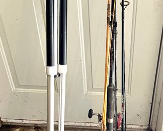 Fishing poles and a camera tripod