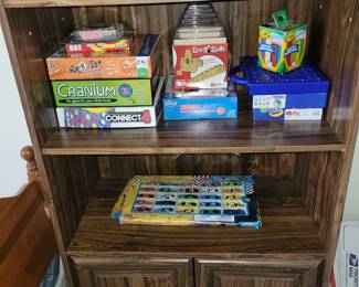 book case and cabinet with board games