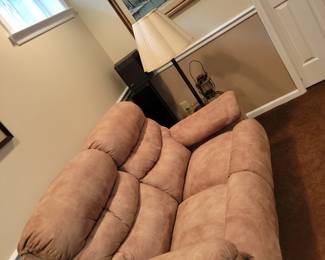 tan suede cloth sofa recliner, art prints, lamp