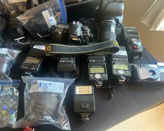 Tons and unique and collectible cameras, lenses and flash attachments and video cameras