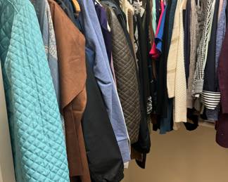 Ladies clothing in multiple sizes including pants, blouses, skirts, jackets, jeans, vests