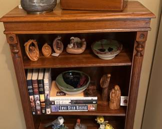 Open shelf case with carved accents