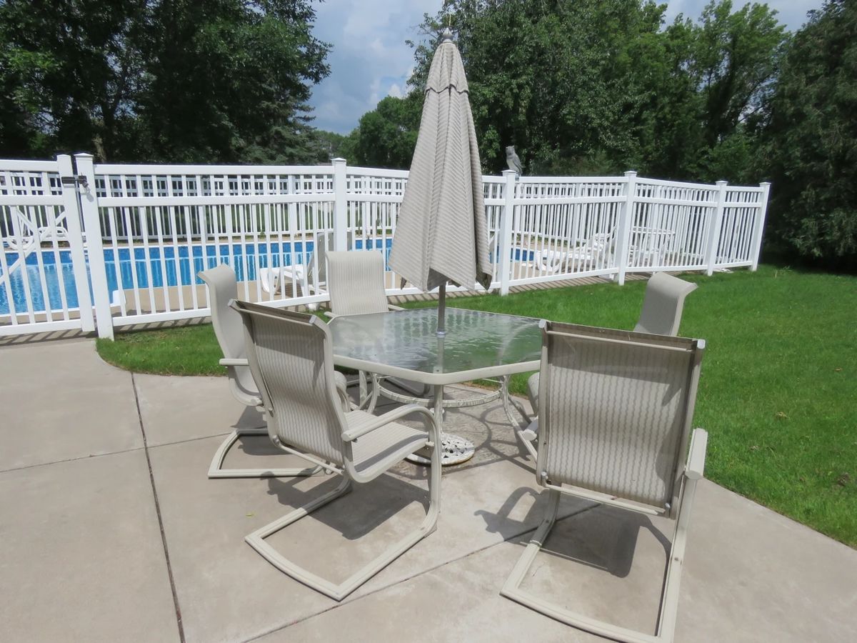 Lot 2. Patio table, umbrella and six chairs