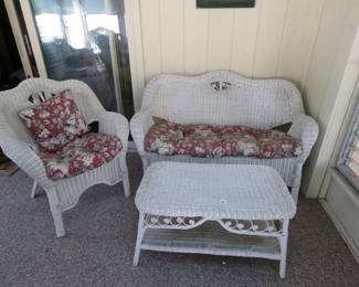 Lot 22. Wicker loveseat, chair, and coffee table