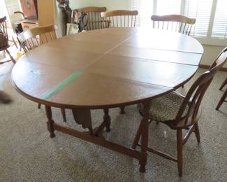 Lot 28. Dining room table and chairs