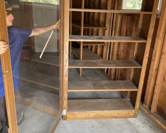 Lot 49. Large bookcase with an open back and&nbsp; hinged Plexiglas door on the front.