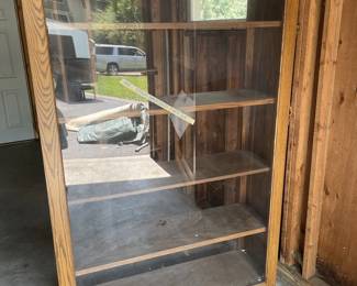 Lot 48. Large bookcase with an open back and&nbsp; hinged Plexiglas door on the front.