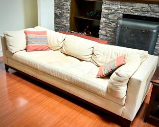 Pale yellow leather tuxedo-style sofa - finished on all sides
