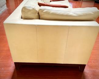 Pale yellow leather tuxedo-style sofa - finished on all sides