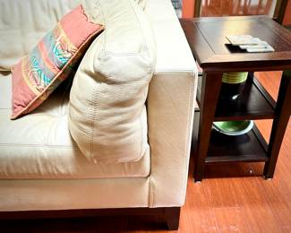 Pale yellow leather tuxedo-style sofa - finished on all sides