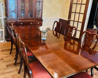 Double pedestal dining table with two leaves and 8 Queen Anne chairs