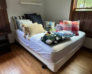 Queen bed and decorative pillows