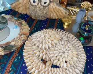 assortment of shell art and sculptures