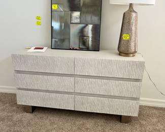 Stunning dresser with textured front surface in excellent condition.  If your home is contemporary then this is a must see.