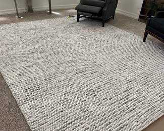 This rug is better in person.  Tight knot in gorgeous grey and cream tones.