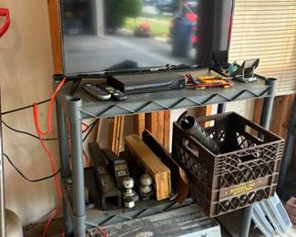 Trailer hitches, shelving, flat screen tv, floor jack