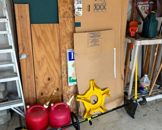 Weed whacker, gas cans, wood