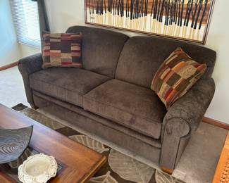 Clean and comfortable sofa couch with accent pillows