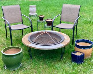 Fire pit. 2 mesh covered chairs. Planter and Glazed pottery pots