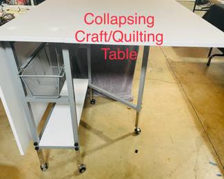 Versatile, rolling, collapsing, craft/quilting table with storage.