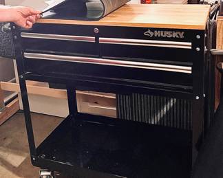 Husky rolling tool box cart. 2 available, this being the smaller. Both covered with rubber matting to protect the wood top.