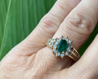 82	$250 	14kt carat gold tested ring with emerald stone &
		moissanites size 5 - 5.12 gr
