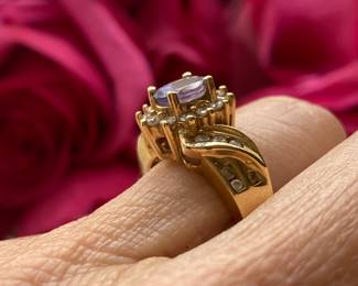 81	$200 	14kt carat gold tested ring with amethyst &
		moissanite size 5 - 5.35 gr  -
