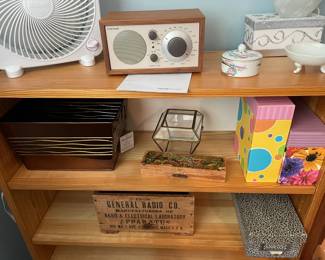 Bookshelf with assorted boxes.