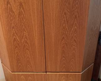 Wood corner storage cabinet.