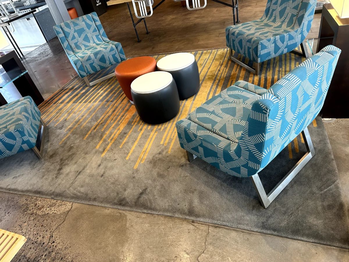 Large Area Rug 12 by 16 $450; blue accent chairs 4 available $300 each, black and white ottomans $100 each x 2