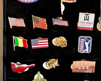 Assorted pins, buttons and tie pins