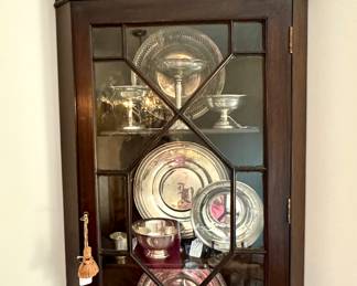 Stunning corner cabinet - packed with sterling