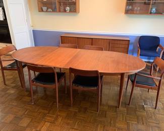 Nils Jonsson Oval teak dining table with w extensions. Chairs sold separately  size 98” x 40”