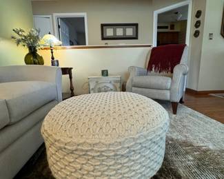 Unique design ottoman in a neutral color. Perfect for any home décor.  