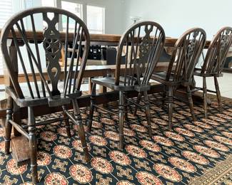 Four antique wheel-back English&nbsp;chairs and wool rug