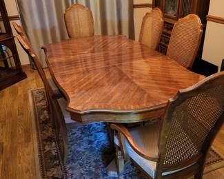 Formal dining table w/6 chairs, 2 leaves, and pads.