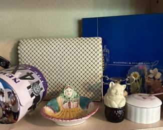 The license plate purse, the white purse in the back and cat on a basket are sold.