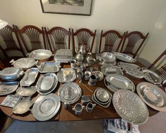 Large number of silver tone metal serving pieces